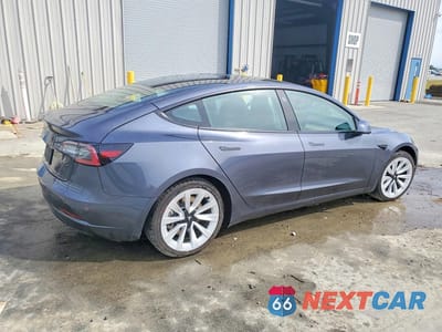 Trzecie zdjęcie samochodu z tyłu: 2022 TESLA MODEL 3 VIN:5YJ3E1EA1NF188364 - miniatura