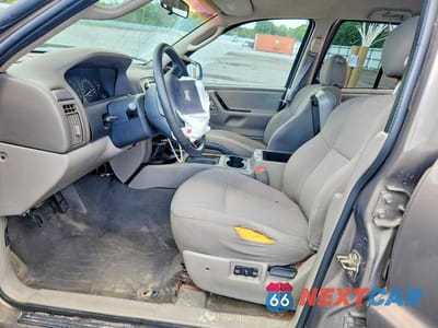 Zdjęcie 7 z 12 samochodu: 2002 JEEP GRAND CHEROKEE LAREDO VIN:1J4GX48S42C306749 - miniatura