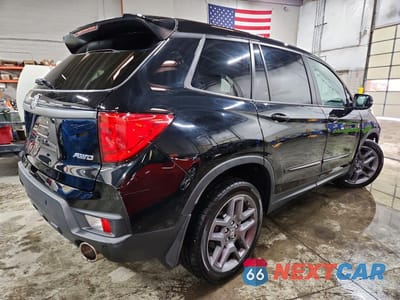 Trzecie zdjęcie samochodu z tyłu: 2023 HONDA PASSPORT EXL VIN:5FNYF8H5XPB008070 - miniatura