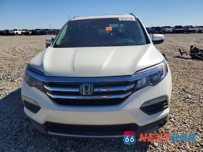 Piąte zdjęcie samochodu w środku: 2017 HONDA PILOT TOURING VIN:5FNYF6H96HB004705 - miniatura