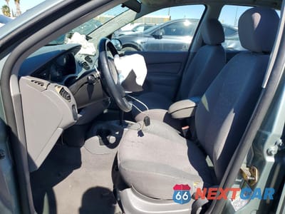 Zdjęcie 7 z 14 samochodu: 2004 FORD FOCUS ZX5 VIN:3FAFP37Z74R110972 - miniatura