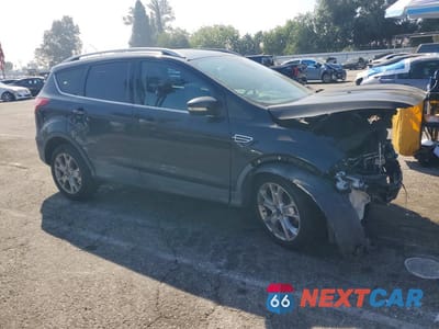 Czwarte zdjęcie samochodu z boku: 2014 FORD ESCAPE TITANIUM VIN:1FMCU0J90EUA07704 - miniatura