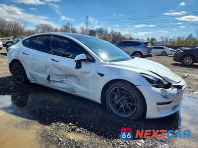 Czwarte zdjęcie samochodu z boku: 2021 TESLA MODEL 3 VIN:5YJ3E1EB8MF060954 - miniatura