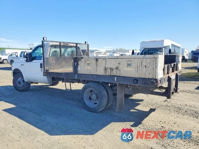 Drugie zdjęcie samochodu z przodu: 1999 FORD F450 SUPER DUTY FLATBED TRUCK VIN:3FDXF46S3XMA32540 - miniatura