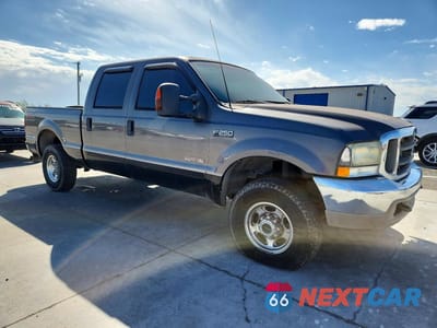 Czwarte zdjęcie samochodu z boku: 2003 FORD F250 SUPER DUTY VIN:1FTNW21P33EC29971 - miniatura