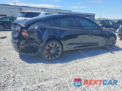Trzecie zdjęcie samochodu z tyłu: 2023 TESLA MODEL 3 VIN:5YJ3E1ECXPF586063 - miniatura