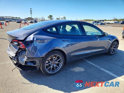 Trzecie zdjęcie samochodu z tyłu: 2023 TESLA MODEL 3 VIN:5YJ3E1EA6PF508474 - miniatura