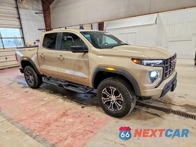 Czwarte zdjęcie samochodu z boku: 2024 GMC CANYON AT4 VIN:1GTP6DEK5R1191601 - miniatura