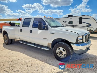 Czwarte zdjęcie samochodu z boku: 2002 FORD F350 SUPER DUTY VIN:1FTWW33F32EC74731 - miniatura