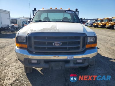 Piąte zdjęcie samochodu w środku: 1999 FORD F450 SUPER DUTY FLATBED TRUCK VIN:3FDXF46S3XMA32540 - miniatura