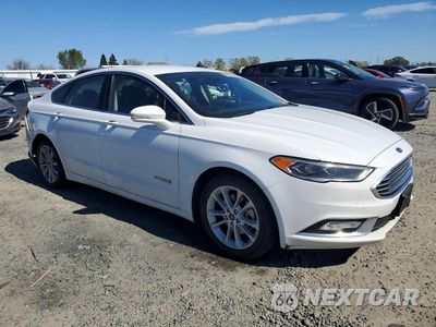 Czwarte zdjęcie samochodu z boku: 2017 FORD FUSION SE HYBRID VIN:3FA6P0LU7HR409523 - miniatura