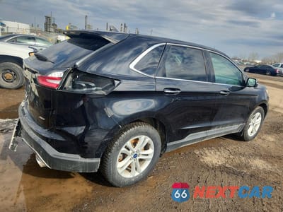 Trzecie zdjęcie samochodu z tyłu: 2022 FORD EDGE TITANIUM VIN:2FMPK4K91NBA48782 - miniatura