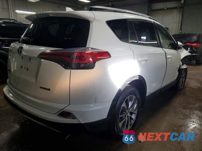 Trzecie zdjęcie samochodu z tyłu: 2018 TOYOTA RAV4 HYBRID LE VIN:JTMRJREV0JD216146 - miniatura
