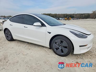 Czwarte zdjęcie samochodu z boku: 2023 TESLA MODEL 3 VIN:5YJ3E1EA5PF422993 - miniatura