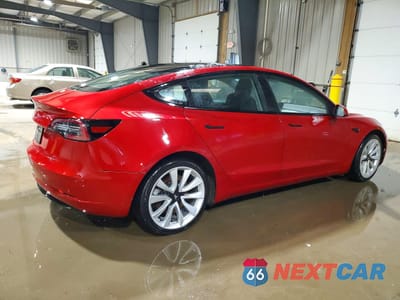 Trzecie zdjęcie samochodu z tyłu: 2023 TESLA MODEL 3 VIN:5YJ3E1EA7PF433669 - miniatura