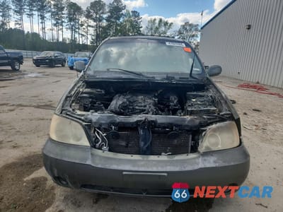 Piąte zdjęcie samochodu w środku: 2005 KIA SEDONA LX VIN:KNDUP132856684204 - miniatura