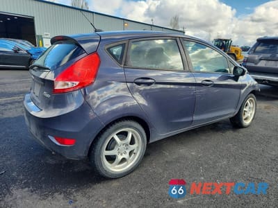 Trzecie zdjęcie samochodu z tyłu: 2012 FORD FIESTA SES VIN:3FADP4FJ4CM135168 - miniatura