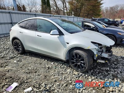 Czwarte zdjęcie samochodu z boku: 2022 TESLA MODEL Y VIN:7SAYGAEE6NF523964 - miniatura