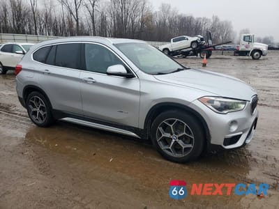 Czwarte zdjęcie samochodu z boku: 2017 BMW X1 XDRIVE28I VIN:WBXHT3Z36H4A53787 - miniatura
