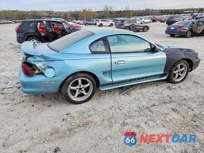 Trzecie zdjęcie samochodu z tyłu: 1997 FORD MUSTANG VIN:1FALP4040VF207937 - miniatura