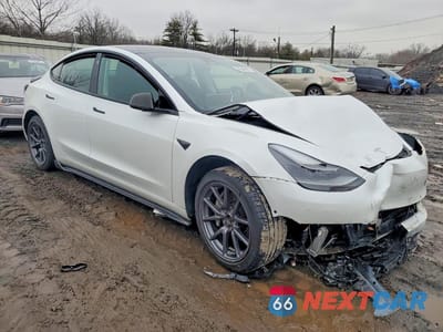 Czwarte zdjęcie samochodu z boku: 2022 TESLA MODEL 3 VIN:5YJ3E1EB1NF174294 - miniatura
