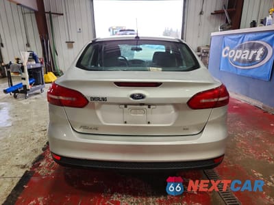 Zdjęcie 6 z 12 samochodu: 2018 FORD FOCUS SE VIN:1FADP3F23JL301357 - miniatura