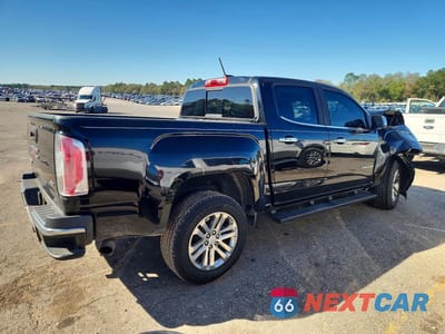 Trzecie zdjęcie samochodu z tyłu: 2016 GMC CANYON SLT VIN:1GTG5DE37G1356718 - miniatura
