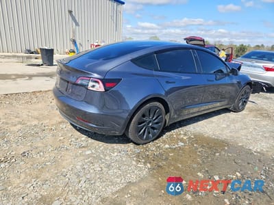 Trzecie zdjęcie samochodu z tyłu: 2022 TESLA MODEL 3 VIN:5YJ3E1EB4NF259484 - miniatura