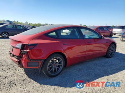 Trzecie zdjęcie samochodu z tyłu: 2023 TESLA MODEL 3 VIN:5YJ3E1EA7PF594264 - miniatura