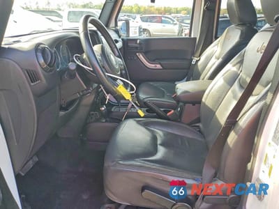 Zdjęcie 7 z 12 samochodu: 2015 JEEP WRANGLER UNLIMITED SAHARA VIN:1C4BJWEG0FL504456 - miniatura