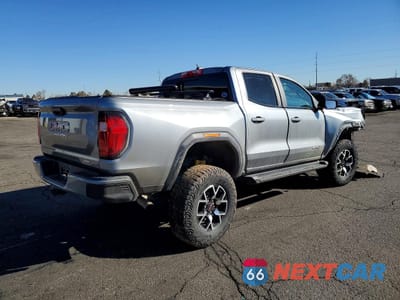 Trzecie zdjęcie samochodu z tyłu: 2024 GMC CANYON AT4X VIN:1GTP6EEK7R1114718 - miniatura