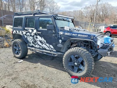 Czwarte zdjęcie samochodu z boku: 2013 JEEP WRANGLER UNLIMITED SPORT VIN:1C4BJWDG1DL514637 - miniatura