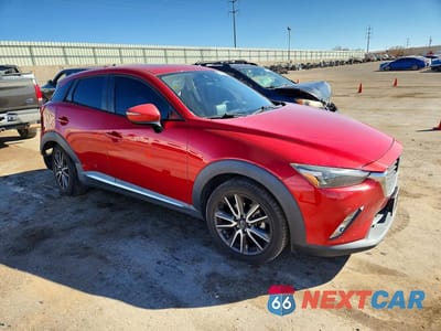 Czwarte zdjęcie samochodu z boku: 2016 MAZDA CX-3 GRAND TOURING VIN:JM1DKBD7XG0107081 - miniatura
