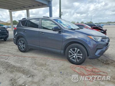 Czwarte zdjęcie samochodu z boku: 2018 TOYOTA RAV4 LE VIN:JTMBFREV9JJ724653 - miniatura