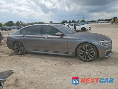 Czwarte zdjęcie samochodu z boku: 2018 BMW M760 XI VIN:WBA7H6C50JG614490 - miniatura
