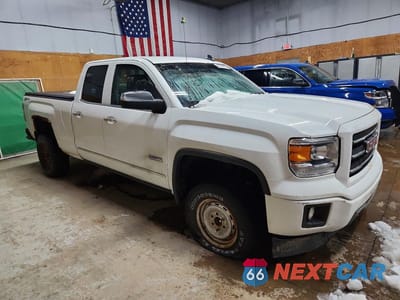 Czwarte zdjęcie samochodu z boku: 2015 GMC SIERRA K1500 SLT VIN:1GTV2VEC7FZ153432 - miniatura