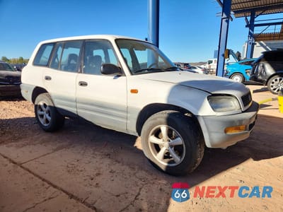 Czwarte zdjęcie samochodu z boku: 1997 TOYOTA RAV4 BASE VIN:JT3GP10VXV7017693 - miniatura
