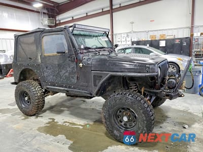 Czwarte zdjęcie samochodu z boku: 1998 JEEP WRANGLER / TJ SE VIN:1J4FY29P9WP710149 - miniatura