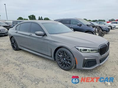 Czwarte zdjęcie samochodu z boku: 2022 BMW 750 XI VIN:WBA7U2C01NCG92527 - miniatura