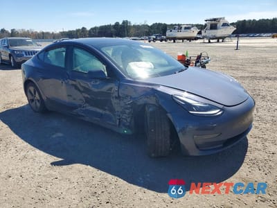 Czwarte zdjęcie samochodu z boku: 2023 TESLA MODEL 3 VIN:5YJ3E1EB0PF680038 - miniatura