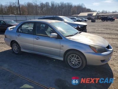 Czwarte zdjęcie samochodu z boku: 2005 MITSUBISHI LANCER OZ RALLY VIN:JA3AJ86E95U012360 - miniatura