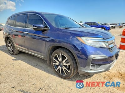 Czwarte zdjęcie samochodu z boku: 2022 HONDA PILOT TOURING VIN:5FNYF5H65NB002911 - miniatura