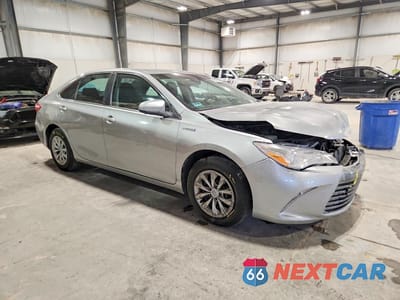 Czwarte zdjęcie samochodu z boku: 2015 TOYOTA CAMRY HYBRID LE VIN:4T1BD1FKXFU167801 - miniatura