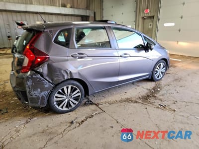 Trzecie zdjęcie samochodu z tyłu: 2015 HONDA FIT EX VIN:3HGGK5G8XFM725355 - miniatura