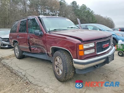 Czwarte zdjęcie samochodu z boku: 1999 GMC YUKON SLE VIN:1GKEK13R5XJ718538 - miniatura