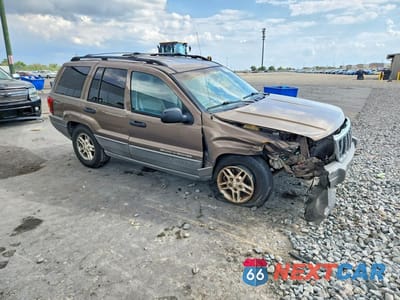 Czwarte zdjęcie samochodu z boku: 2002 JEEP GRAND CHEROKEE LAREDO VIN:1J4GX48S42C306749 - miniatura
