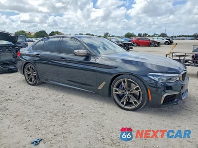 Czwarte zdjęcie samochodu z boku: 2019 BMW M550XI VIN:WBAJB9C58KB464295 - miniatura