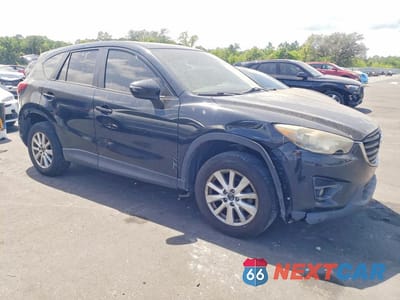 Czwarte zdjęcie samochodu z boku: 2016 MAZDA CX-5 TOURING VIN:JM3KE2CY1G0619313 - miniatura