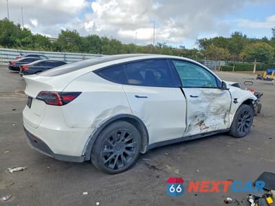 Trzecie zdjęcie samochodu z tyłu: 2023 TESLA MODEL Y VIN:7SAYGDEE7PA188182 - miniatura