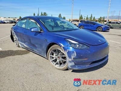Czwarte zdjęcie samochodu z boku: 2021 TESLA MODEL 3 VIN:5YJ3E1EB4MF073409 - miniatura